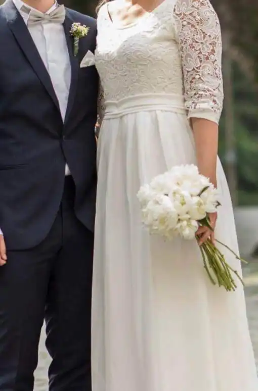 Blumendekoration für Hochzeit mit warmen Farbakzenten